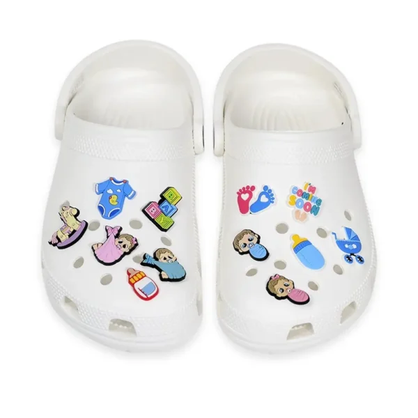 White Crocs with adorable Infant Shoe Charms, including baby boy and girl designs, pacifier, bottle, stroller, onesie, baby footprints, and "I'm Coming Soon" charm.
