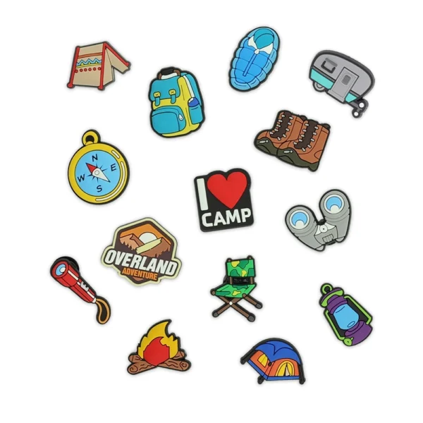 Camping-themed charms, including a tent, hiking boots, backpack, campfire, compass, and adventure icons.