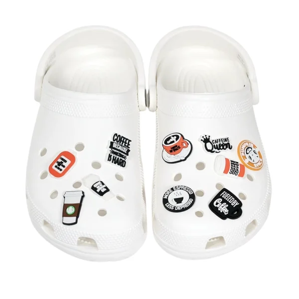 White footwear decorated with Coffee Shoe Charms, including coffee cups, espresso shots, and witty caffeine quotes.