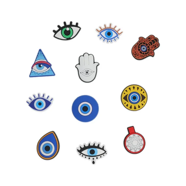Shoe charms featuring Evil Eye, Hamsa hand, and mystical symbols on white slip-on sandals