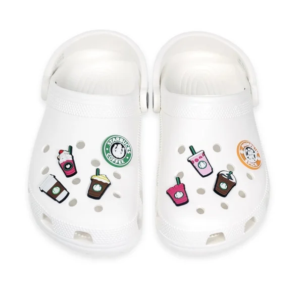 White footwear decorated with Starbucks Coffee Shoe Charm, including iced coffee, frappuccino, and latte-inspired designs.
