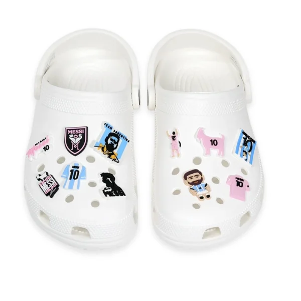 White footwear decorated with Messi-themed charms, featuring Argentina jerseys, Inter Miami FC logos, soccer elements, and the number 10