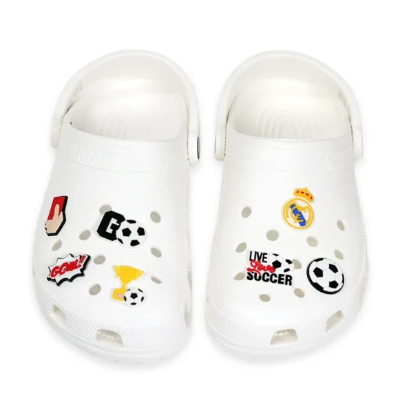 Real Madrid-themed shoe charms, including a football, goal sign, trophy, red card, and "Live Love Soccer" text