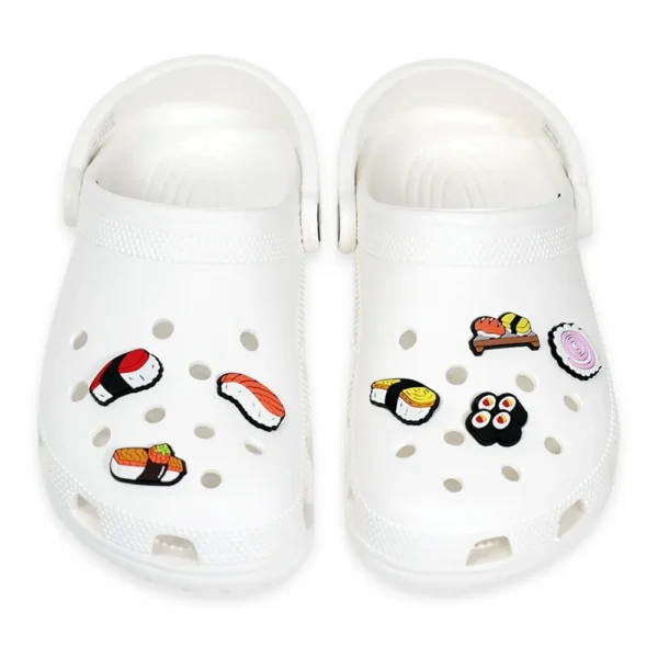 White footwear decorated with Sushi & Nigiri Shoe Charms, including nigiri, maki rolls, and ramen-inspired designs.
