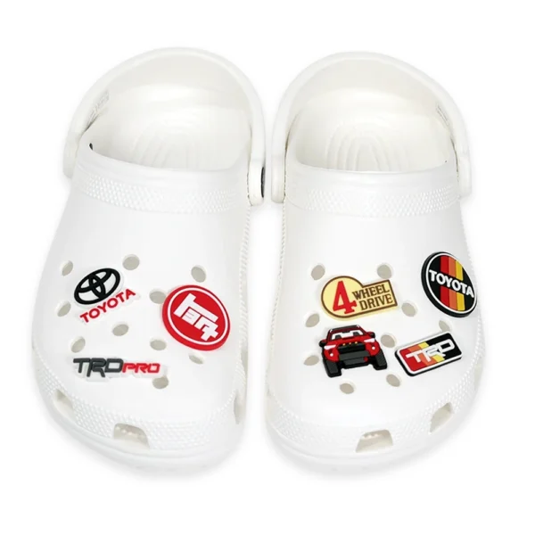 White Crocs decorated with Toyota 4Runner and off-road-themed charms, perfect for SUV enthusiasts and adventure seekers.