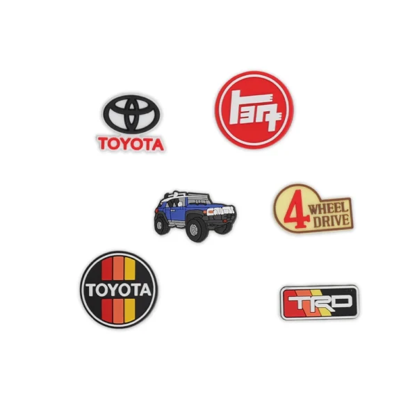 Toyota FJ Cruiser Blue, Toyota logos, TRD Pro badge, and off-road 4x4 emblem shoe charms.
