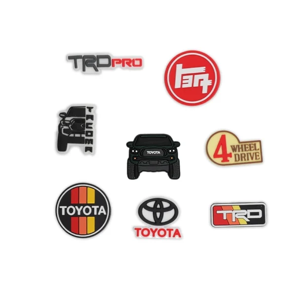 Toyota Tacoma Green, Toyota logos, TRD Pro badge, and off-road 4x4 emblem shoe charms.