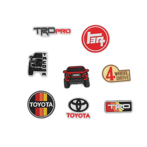 Toyota Tacoma Red, Toyota logos, TRD Pro badge, and off-road 4x4 emblem shoe charms.