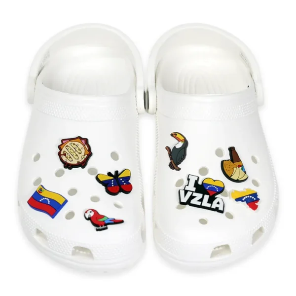 Venezuelan shoe charms, including a flag, arepa, toucan, butterfly, and other national symbols.
