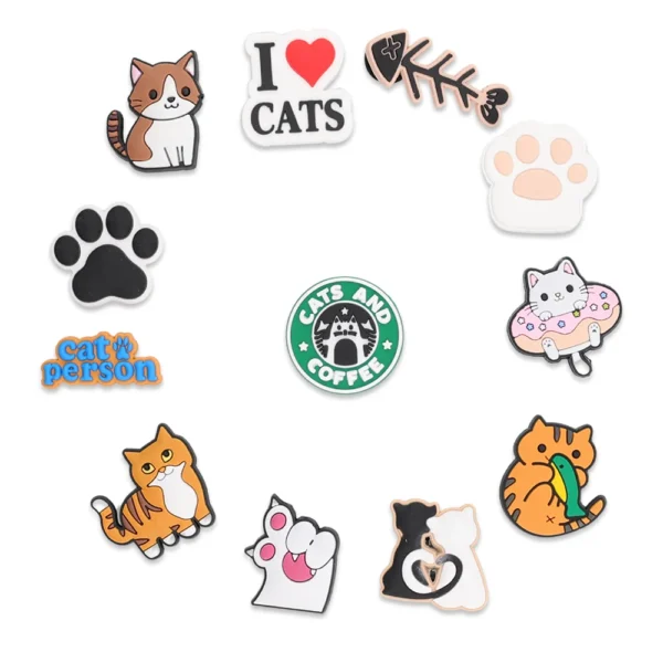 Cat charms on white Crocs - The Cat Charms for Crocs Bundle is the perfect pack for cat lovers. This set includes 12 adorable charms shaped like kittens, paw prints, and expressive cat faces to bring feline personality to your Crocs.