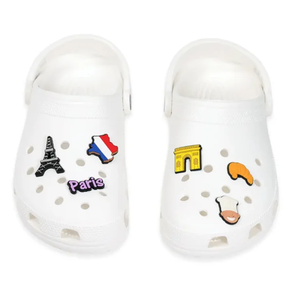 France-themed charms on white Crocs