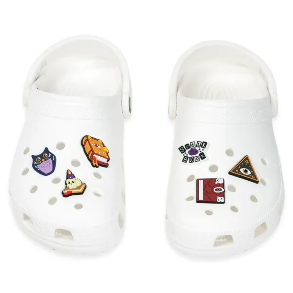 6 magic charms placed on white Crocs – dark and magical aesthetic
