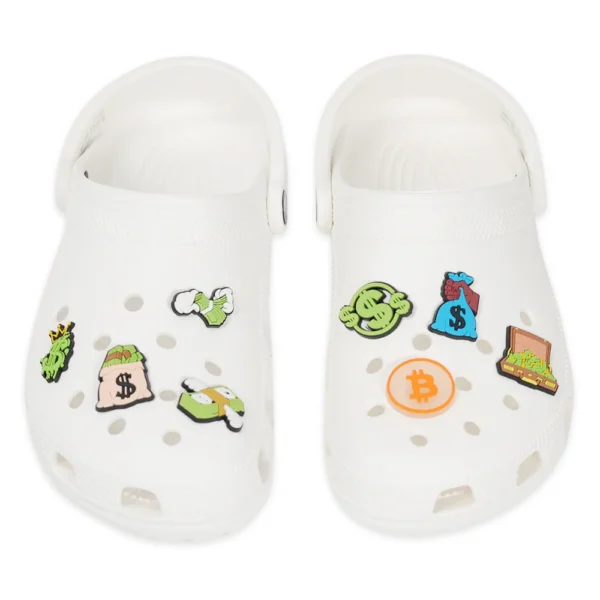 Money shoe charms styled on white Crocs – financial and crypto themes