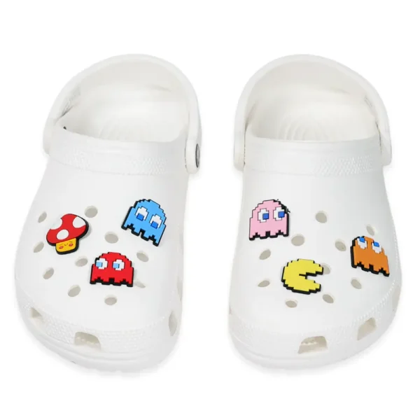 Pacman and ghost charms on white Crocs – retro gamer style